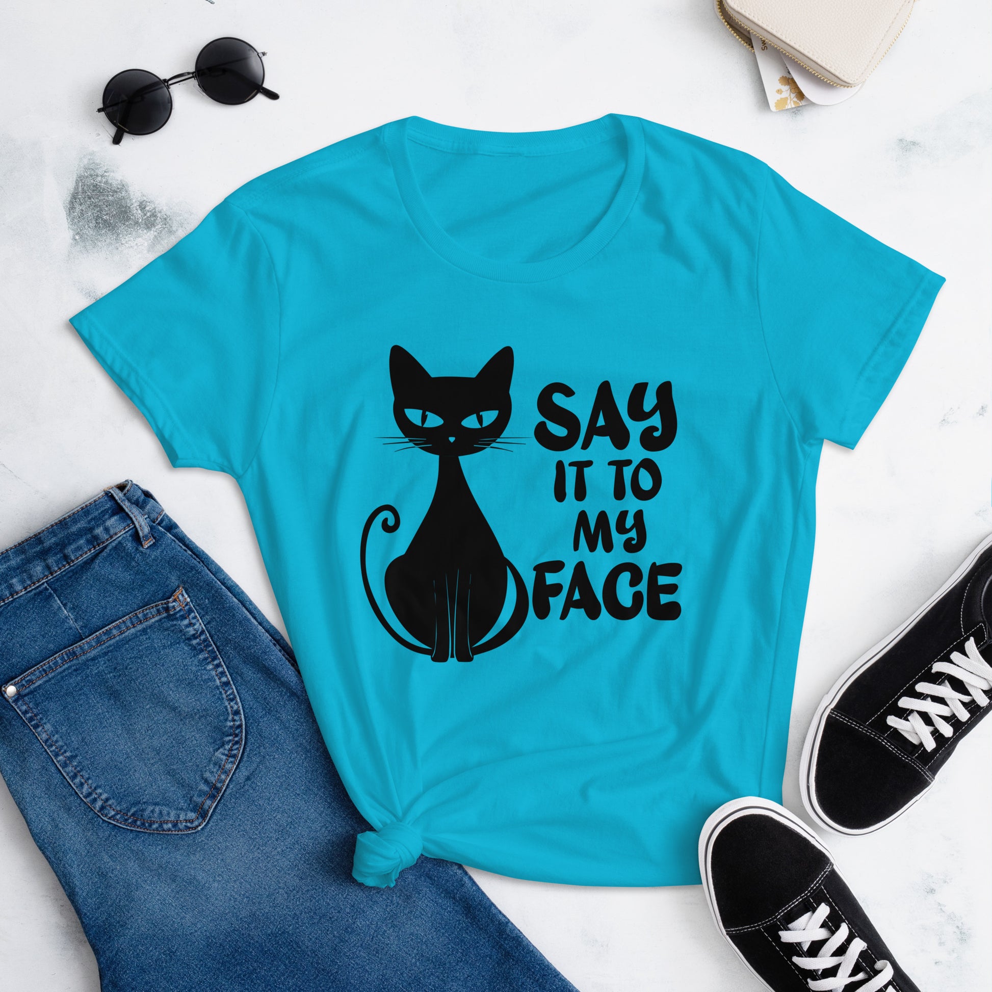 Caribbean Blue t-shirt featuring a black bold and sassy graphic of a cat with the words 'Say It To My Face,' representing confidence and attitude. Perfect for women who embrace their inner feline and want to make a statement with their fashion.