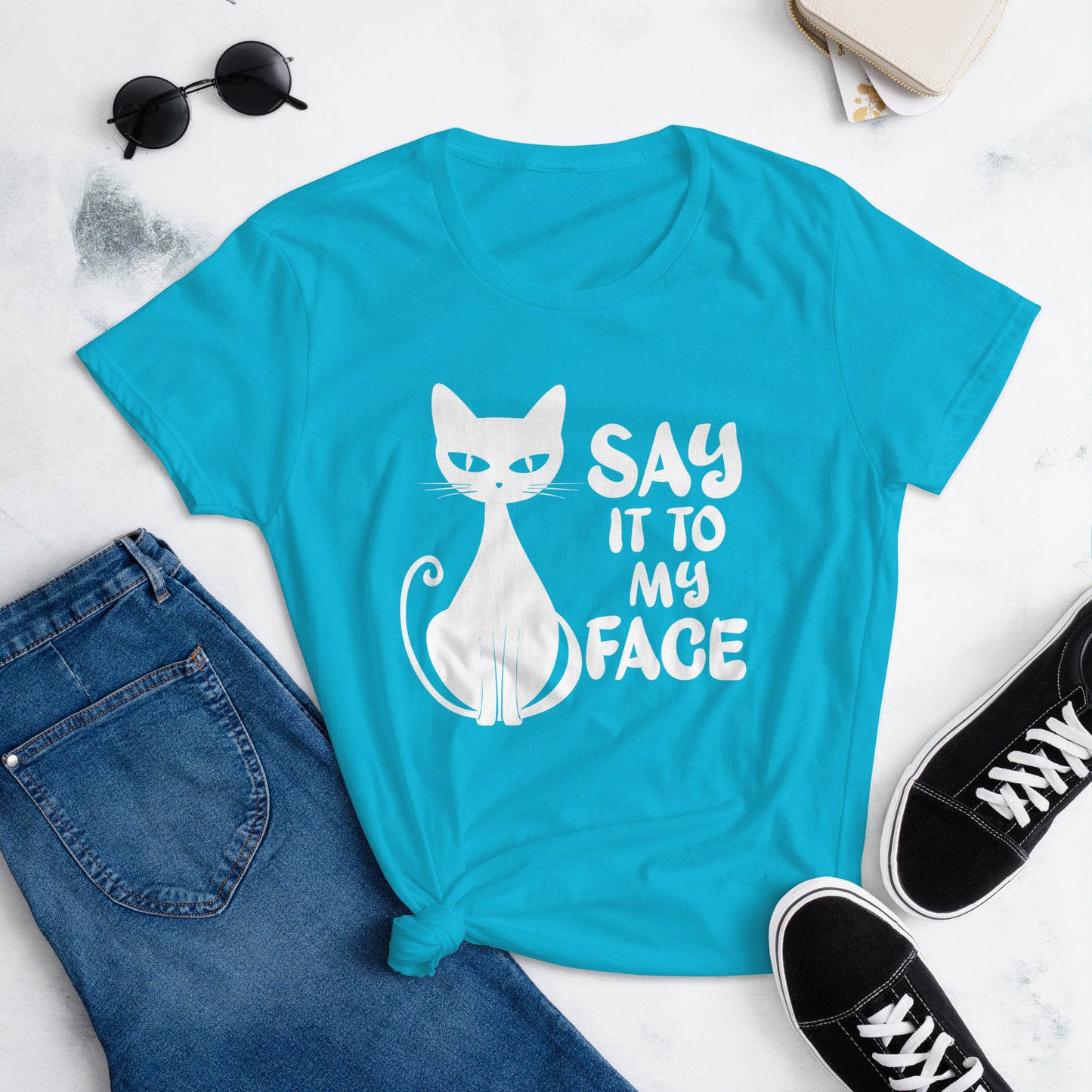 Caribbean Blue t-shirt featuring a white bold and sassy graphic of a cat with the words 'Say It To My Face,' representing confidence and attitude. Perfect for women who embrace their inner feline and want to make a statement with their fashion.