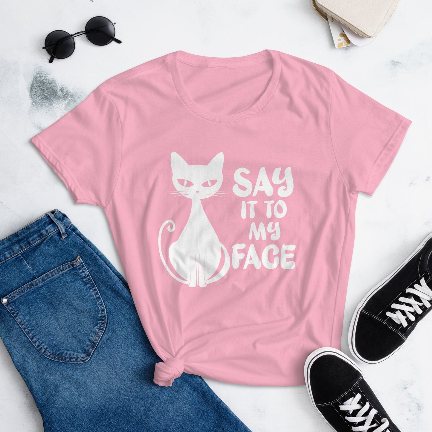 Charity Pink t-shirt featuring a white bold and sassy graphic of a cat with the words 'Say It To My Face,' representing confidence and attitude. Perfect for women who embrace their inner feline and want to make a statement with their fashion.