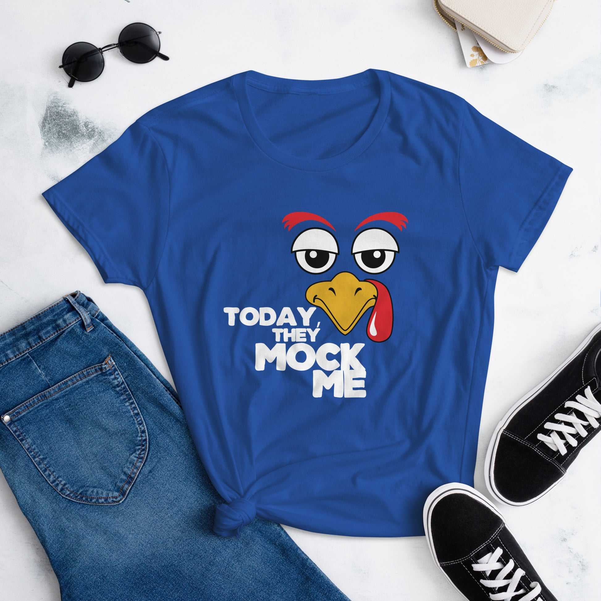 Royal Blue t-shirt with a humorous graphic of a turkey and the phrase 'Today They Mock Me' in bold white text. The bird has an expressive face with its tongue out, adding a playful and comedic touch to the design.