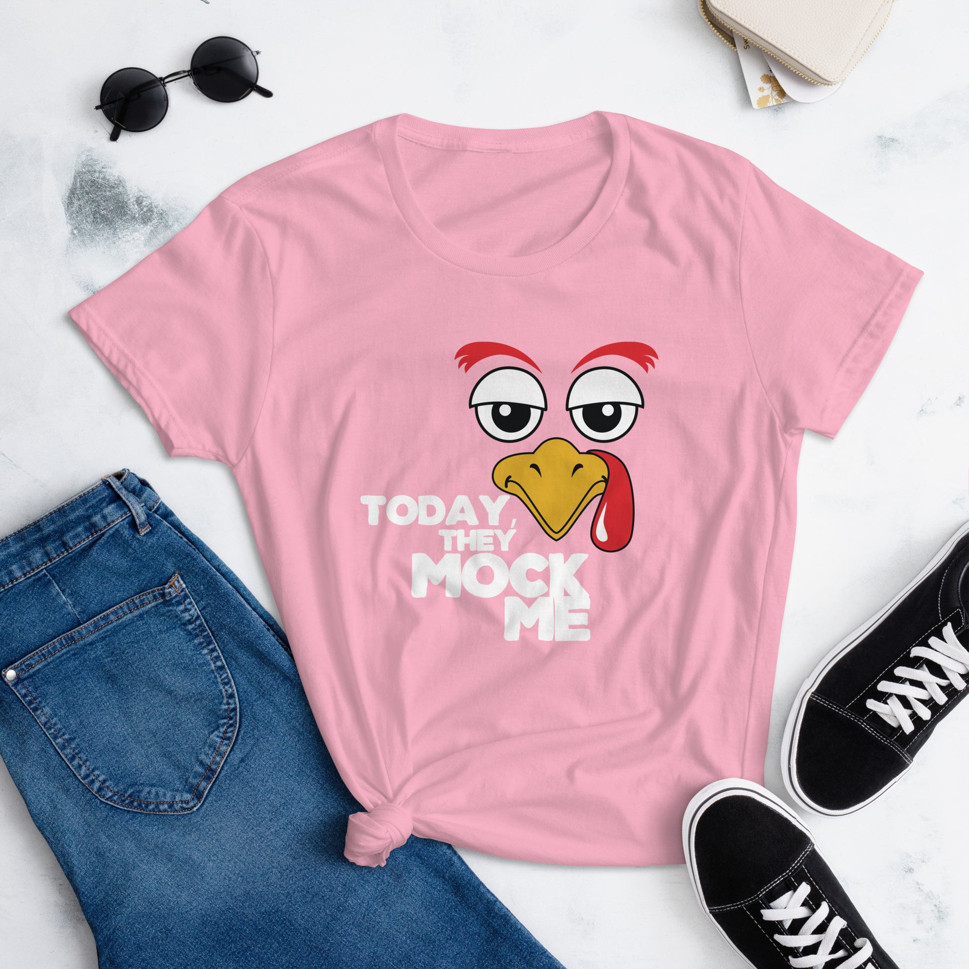 Charity Pink t-shirt with a humorous graphic of a turkey and the phrase 'Today They Mock Me' in bold white text. The bird has an expressive face with its tongue out, adding a playful and comedic touch to the design.