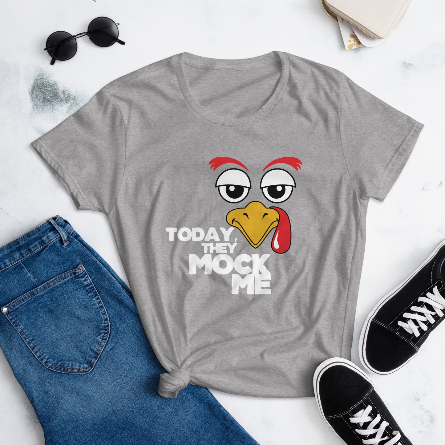 Black t-shirt with a humorous graphic of a turkey and the phrase 'Today They Mock Me' in bold white text. The bird has an expressive face with its tongue out, adding a playful and comedic touch to the design.