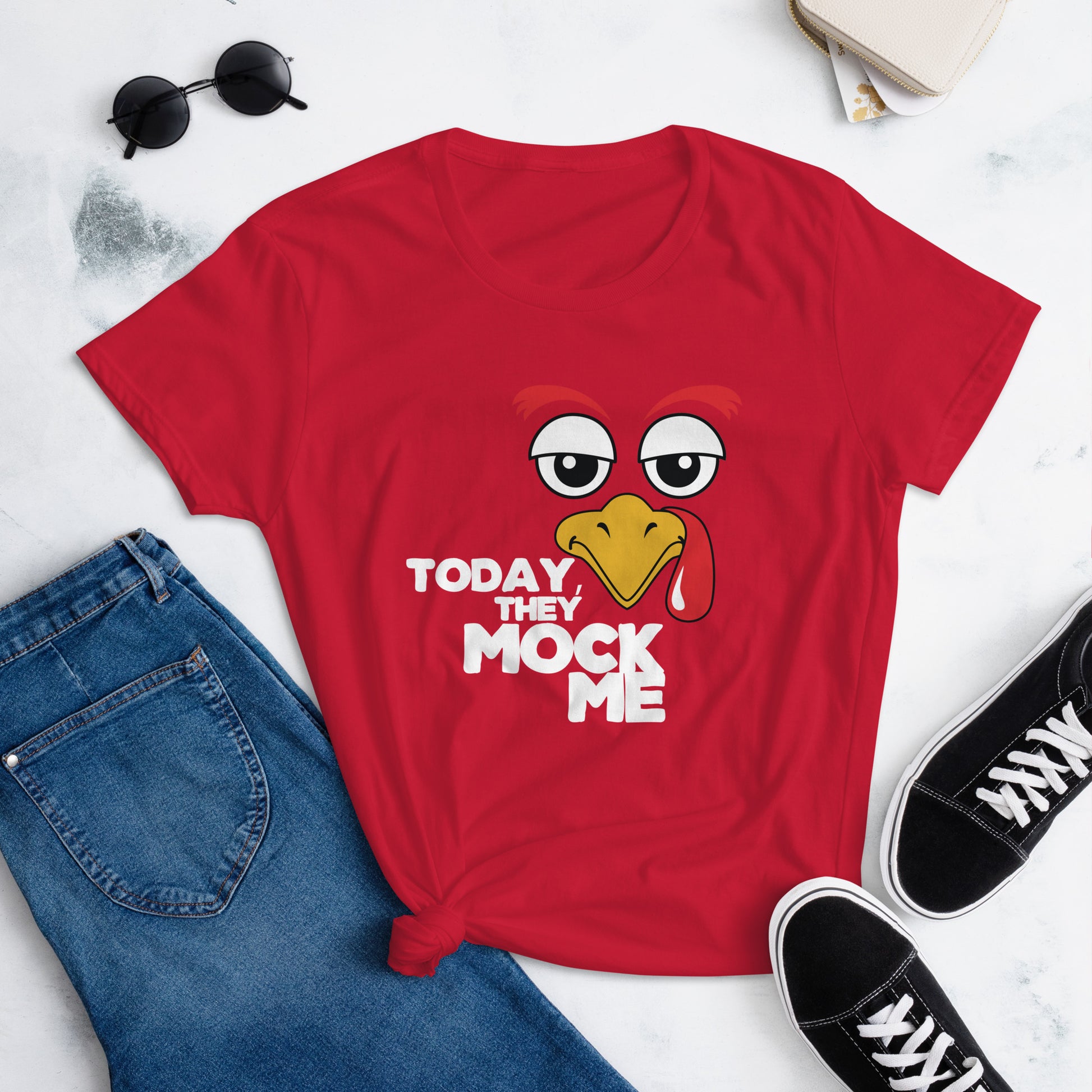 Black t-shirt with a humorous graphic of a turkey and the phrase 'Today They Mock Me' in bold white text. The bird has an expressive face with its tongue out, adding a playful and comedic touch to the design.