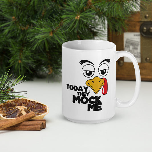 Illustration of a turkey with a mocking expression and the text 'Today, They Mock Me' in bold letters on a white ceramic mug. 15oz