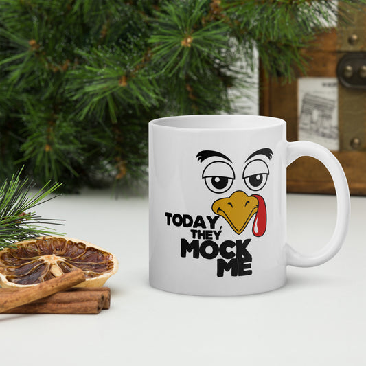 Illustration of a turkey with a mocking expression and the text 'Today, They Mock Me' in bold letters on a white ceramic mug. 11oz