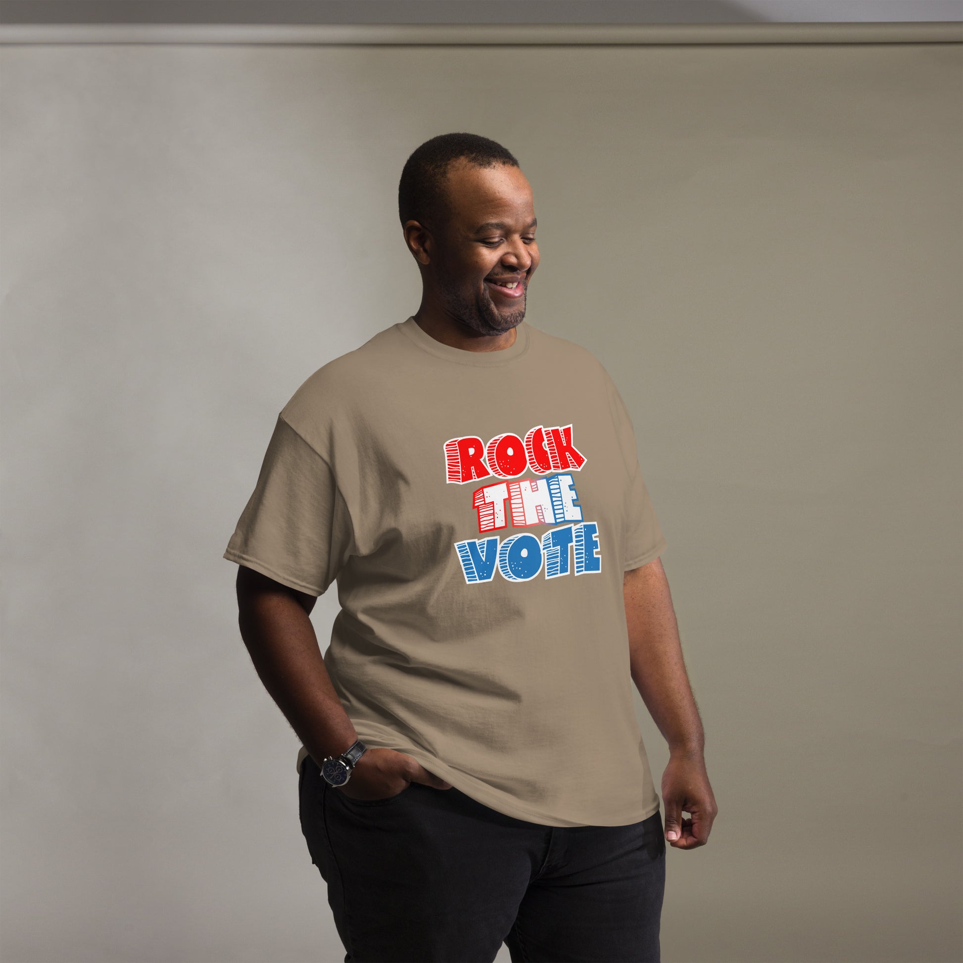 Rock The Vote T-Shirt with bold red, white, and blue lettering inspired by GenX style. The design features a retro, comic-style font with distressed detailing, representing a patriotic election theme. Available in unisex sizes and classic colors, perfect for showing civic pride and encouraging voter participation.