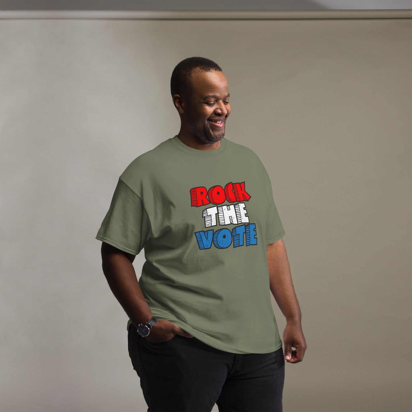 Rock The Vote T-Shirt with bold red, white, and blue lettering inspired by GenX style. The design features a retro, comic-style font with distressed detailing, representing a patriotic election theme. Available in unisex sizes and classic colors, perfect for showing civic pride and encouraging voter participation.