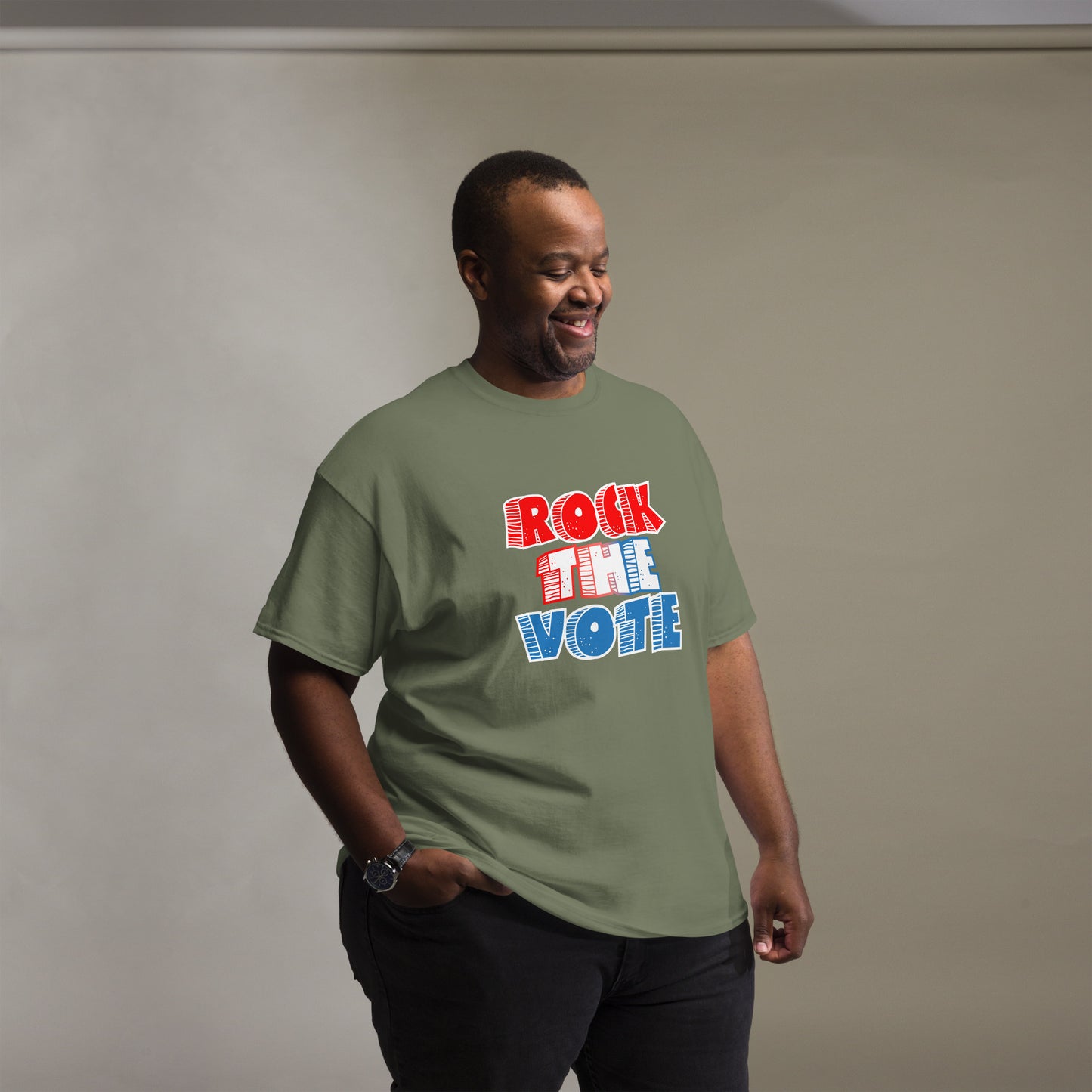 Rock The Vote T-Shirt with bold red, white, and blue lettering inspired by GenX style. The design features a retro, comic-style font with distressed detailing, representing a patriotic election theme. Available in unisex sizes and classic colors, perfect for showing civic pride and encouraging voter participation.