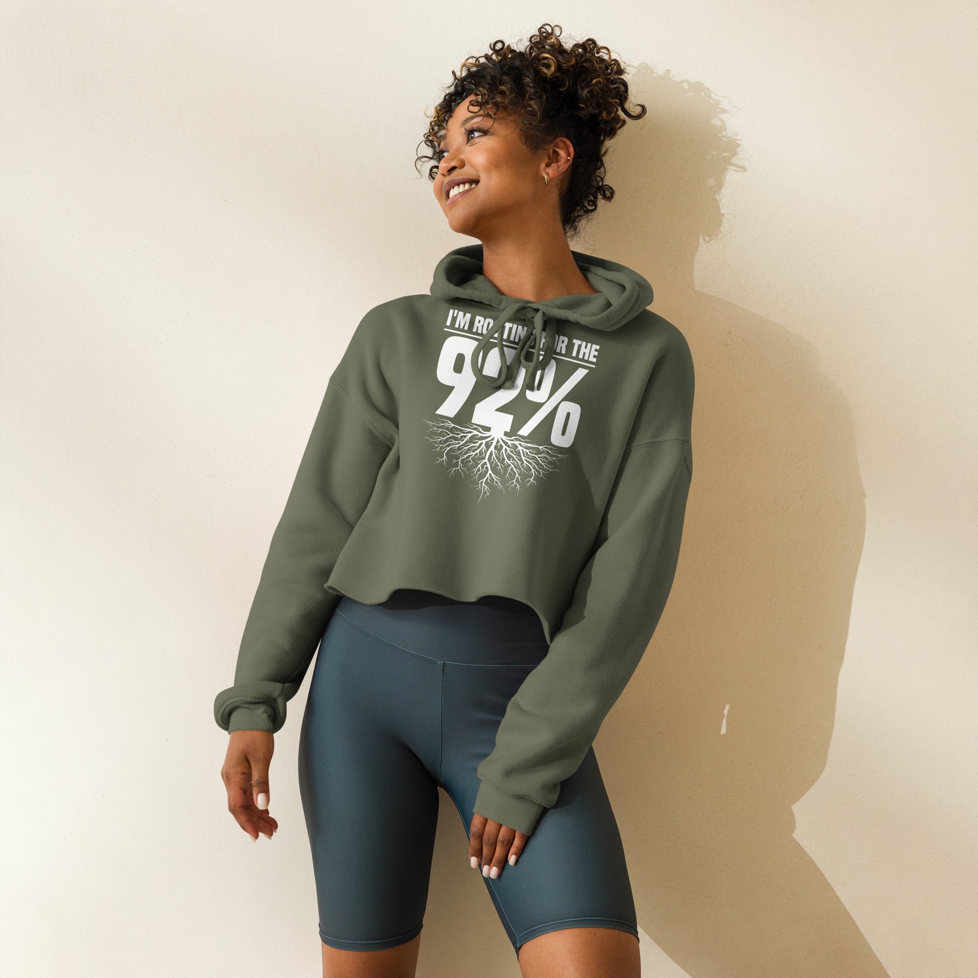 Black crop hoodie with bold white text that reads 'Rooting for the 92%' and a root graphic beneath, celebrating unity and empowerment.