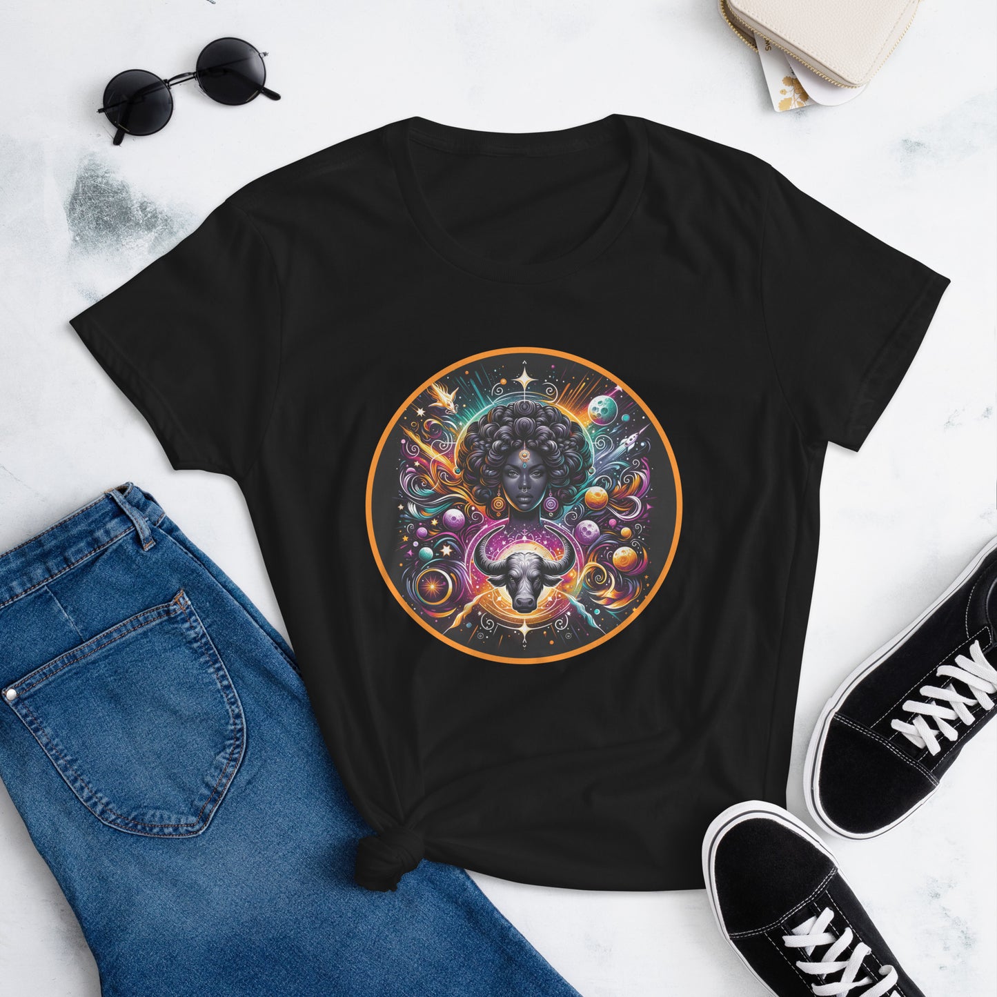 An enchanting Taurus Zodiac Wonders design on a T-shirt, highlighting a powerful Black woman, celestial bodies, and a mythological bull amidst a vibrant cosmic backdrop.