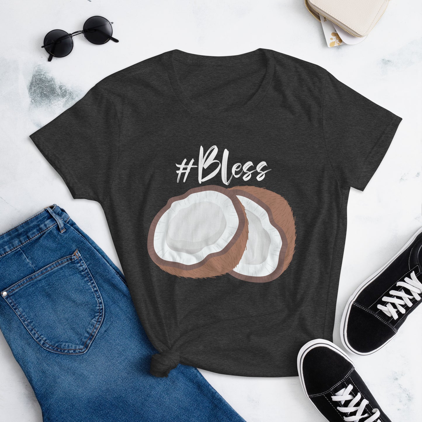 Graphic of a t-shirt featuring a vibrant coconut design and the hashtag #Bless, women.