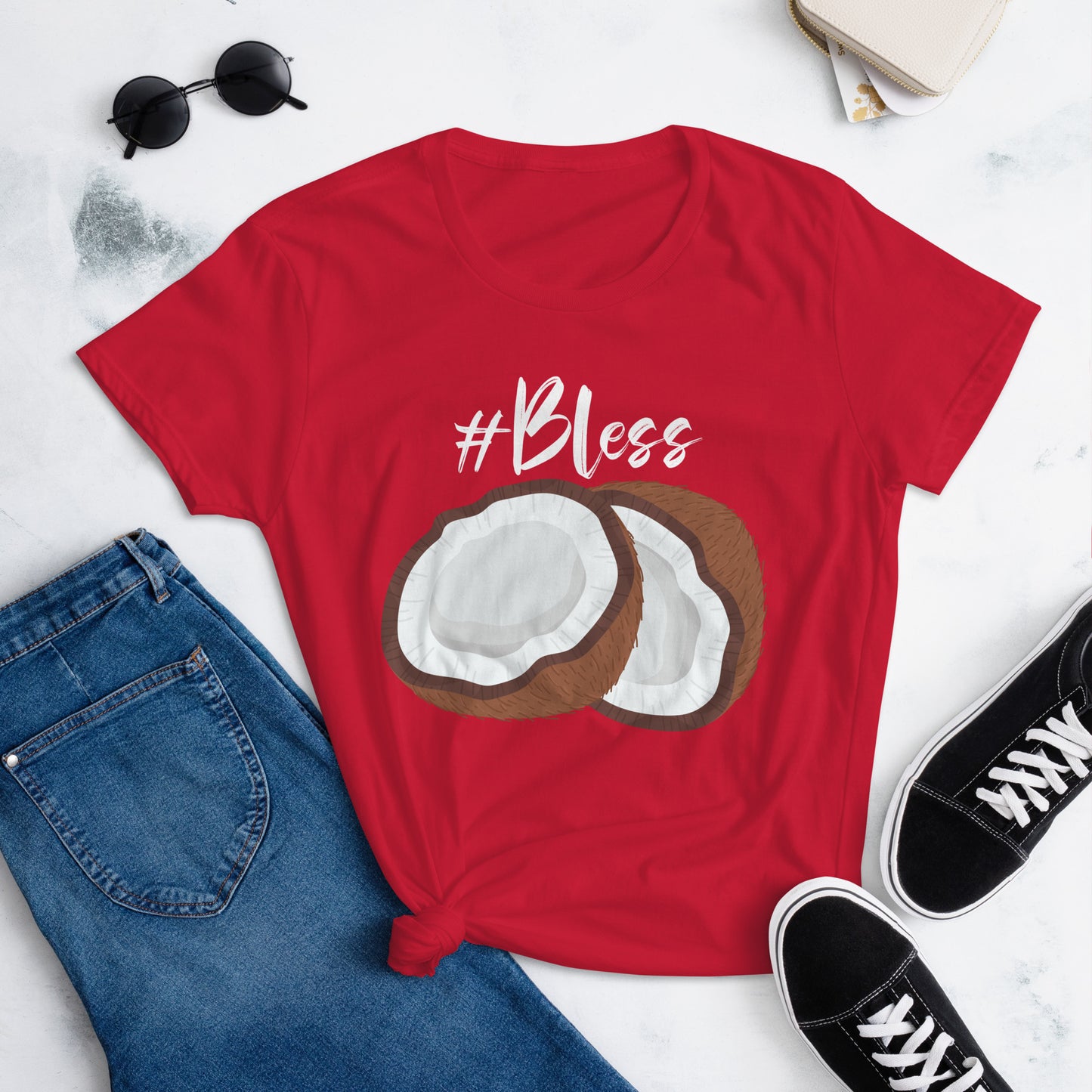 Graphic of a t-shirt featuring a vibrant coconut design and the hashtag #Bless, women.